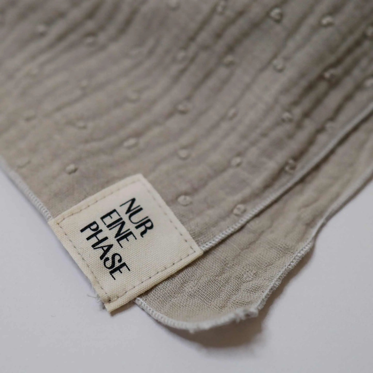 Soft taupe neck scarf for babies, versatile for multiple uses, size 60x60cm.