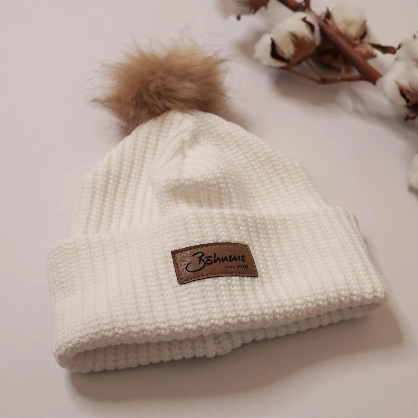 White chunky knit pom-pom hat, trendy and perfect for cold days.