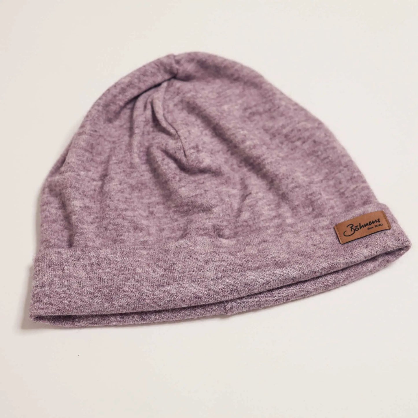 Purple beanie for spring and fall, ideal for warmth and style.