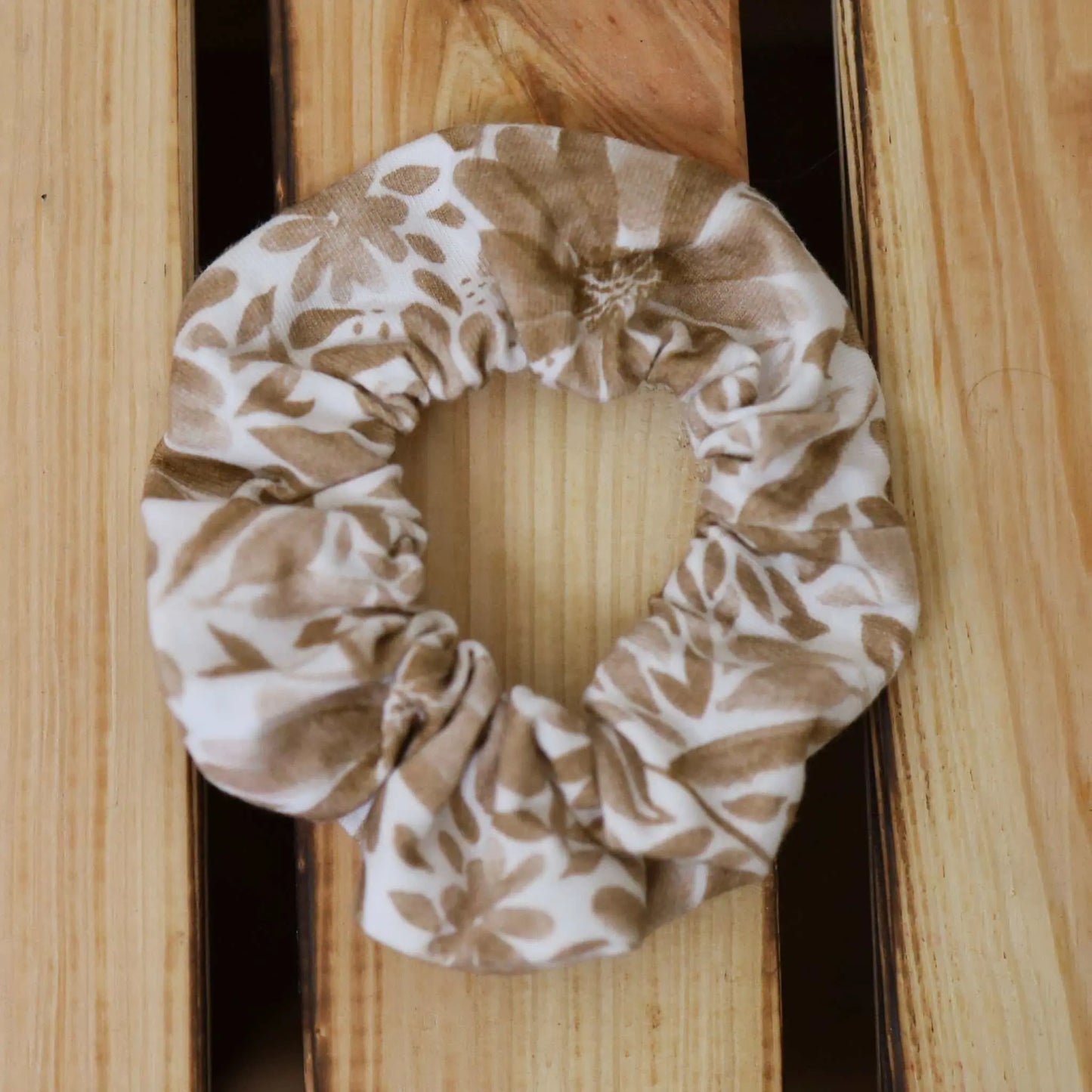 Scrunchie with brown floral pattern made from fabric scraps.