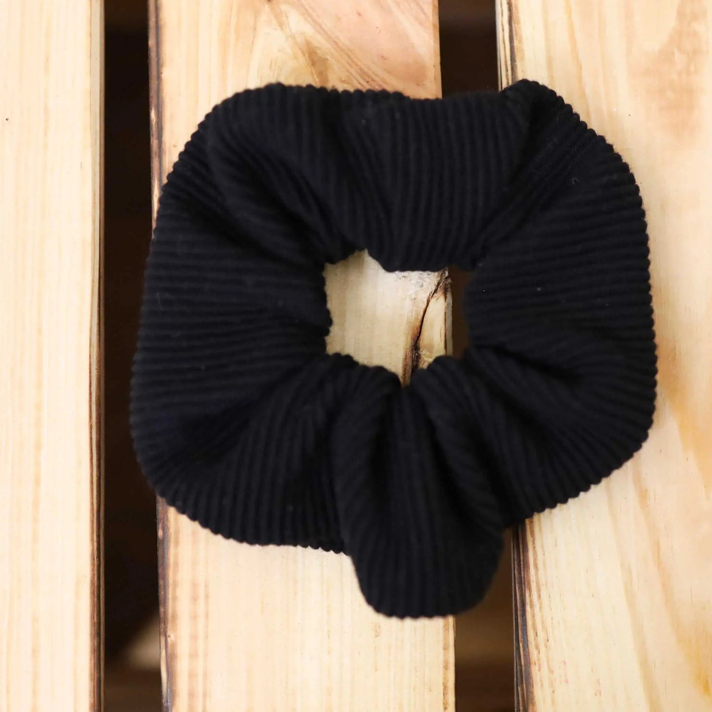 Black jersey rib scrunchie, versatile hair tie and accessory made from fabric remnants.