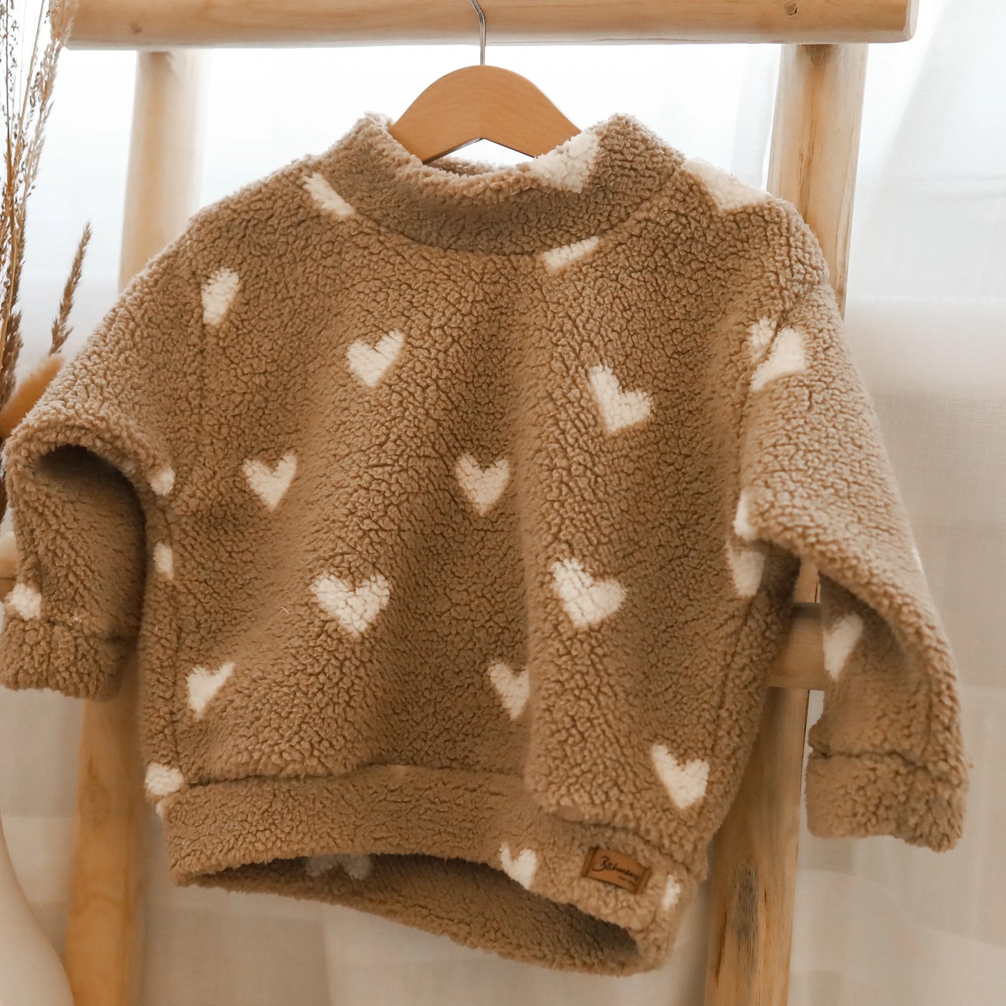 Kuschelsweater mit Herzen